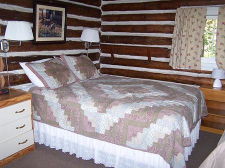 Log cabin bedroom, queen and single bed